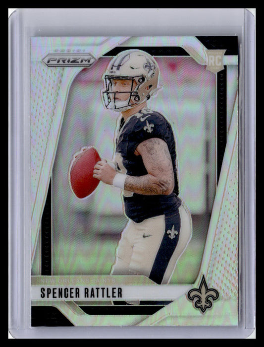 Football trading card of Spencer Rattler in a dark jersey and helmet, holding a football, with 'PRIZM' and 'NFL' branding.