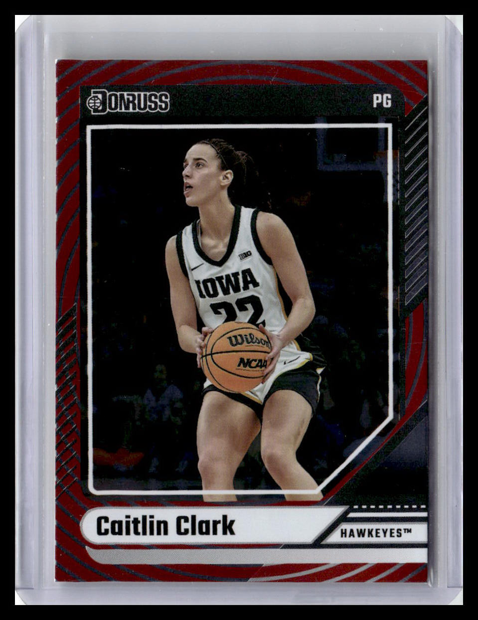Basketball trading card of Caitlin Clark holding a basketball, with Iowa Hawkeyes branding.