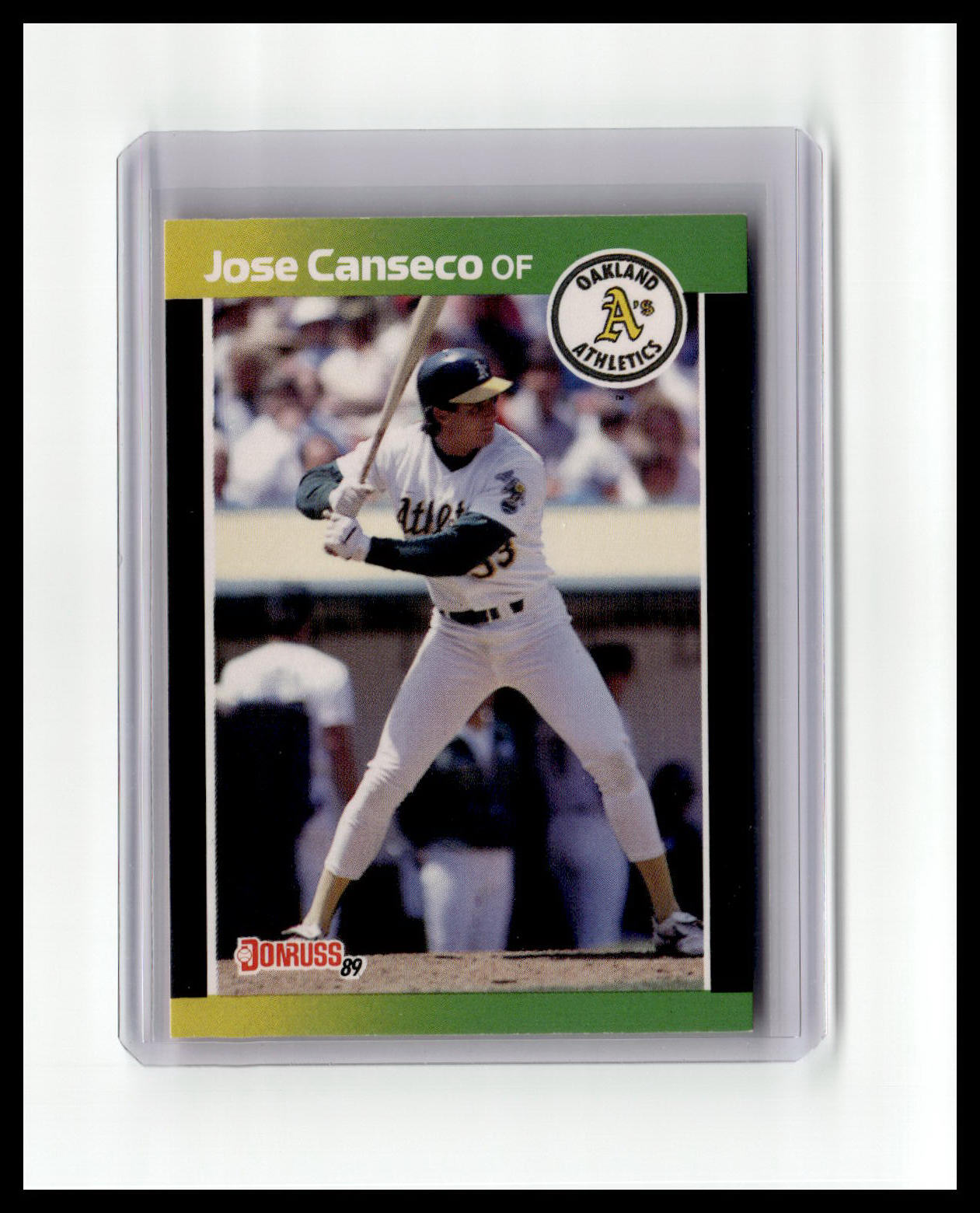 Baseball trading card of Jose Canseco with a green border and Athletics logo.