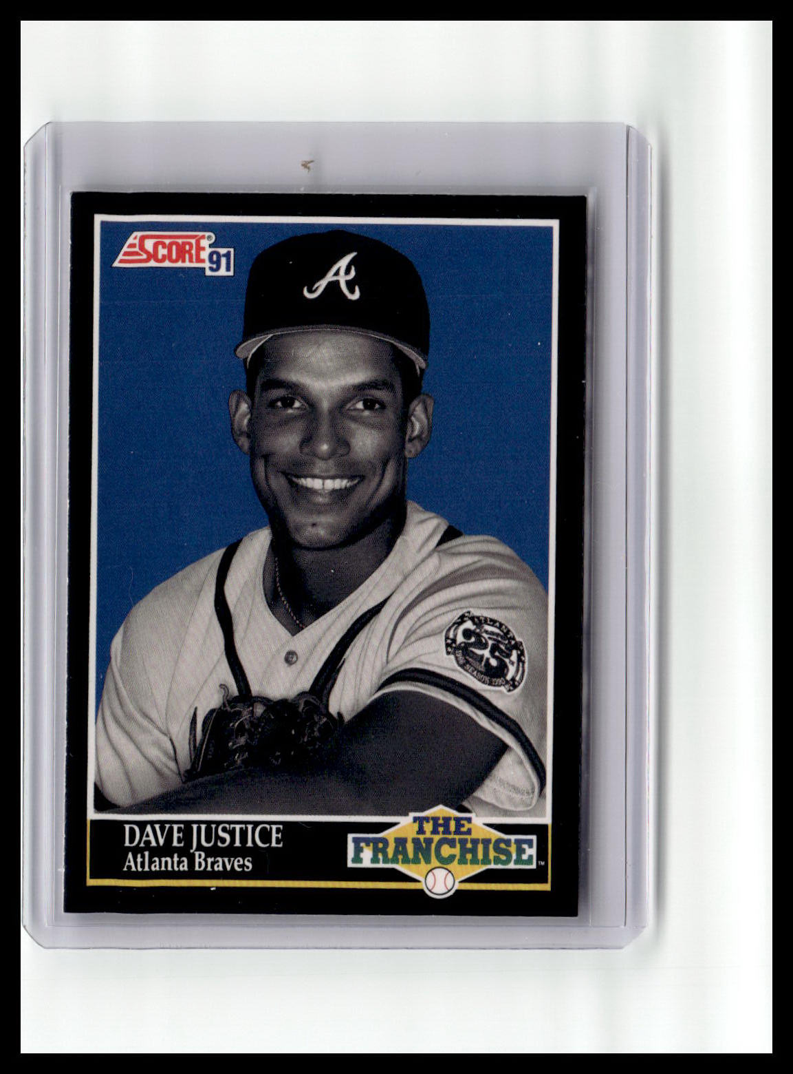 Baseball trading card of Dave Justice with Atlanta Braves uniform on a blue background