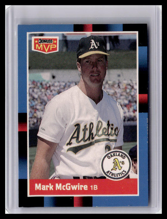 Baseball trading card of Mark McGwire in a white Oakland Athletics uniform with MVP badge.