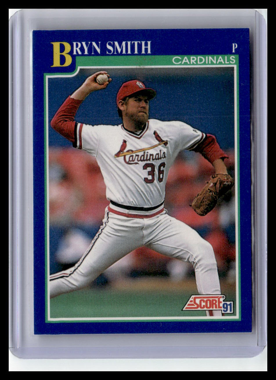 Baseball trading card of a player in a white uniform with red accents, holding a baseball and glove.