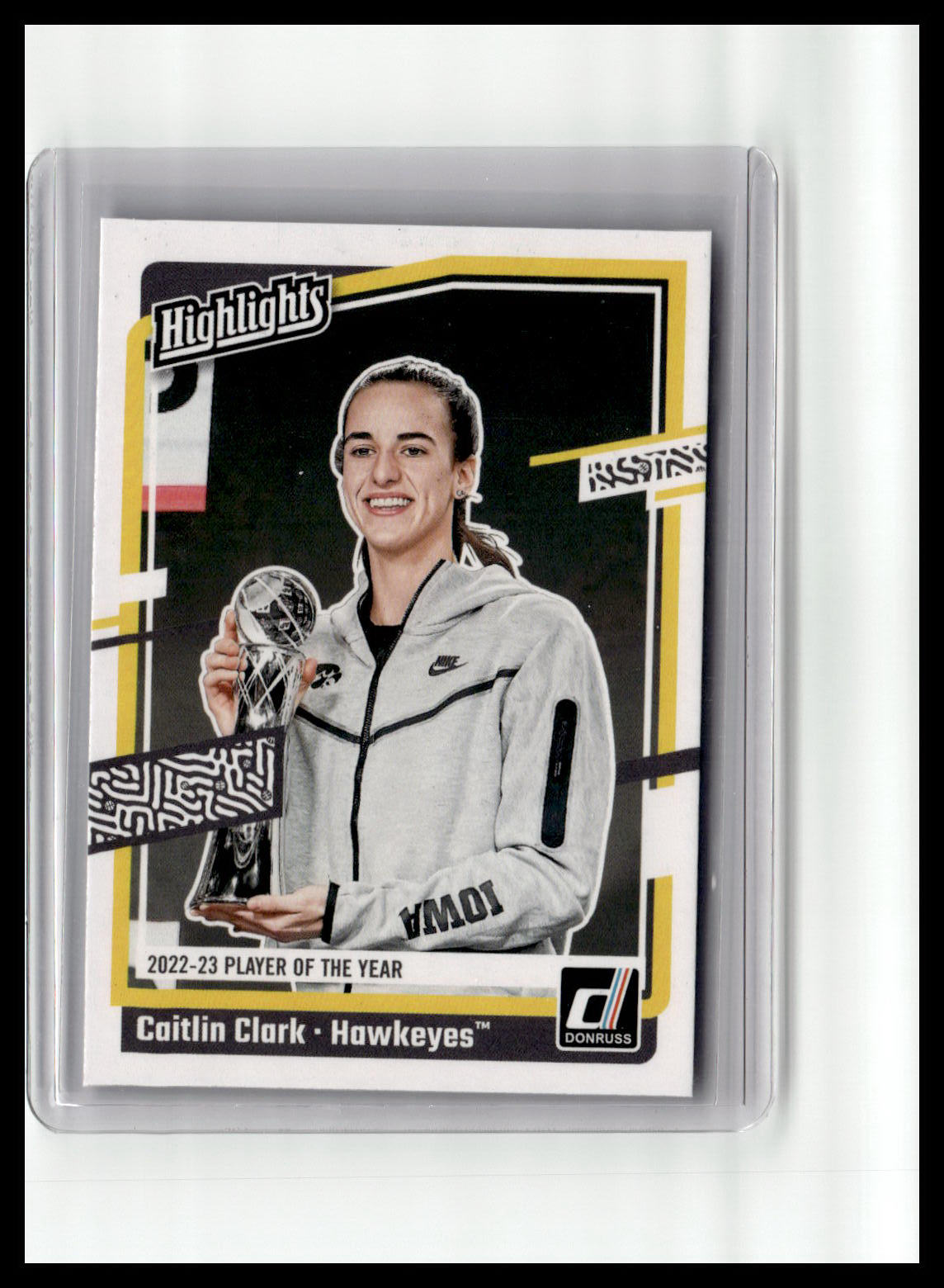 Trading card of Caitlin Clark holding a trophy, framed by 'Highlights' branding.