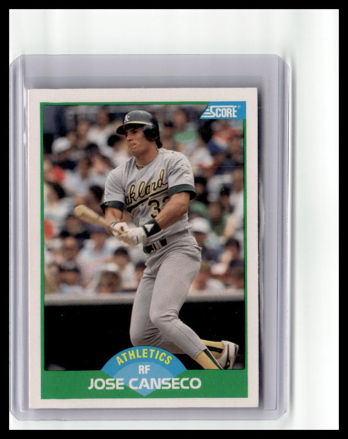 Baseball trading card of Jose Canseco with a gray uniform and bat, surrounded by a protective clear case.