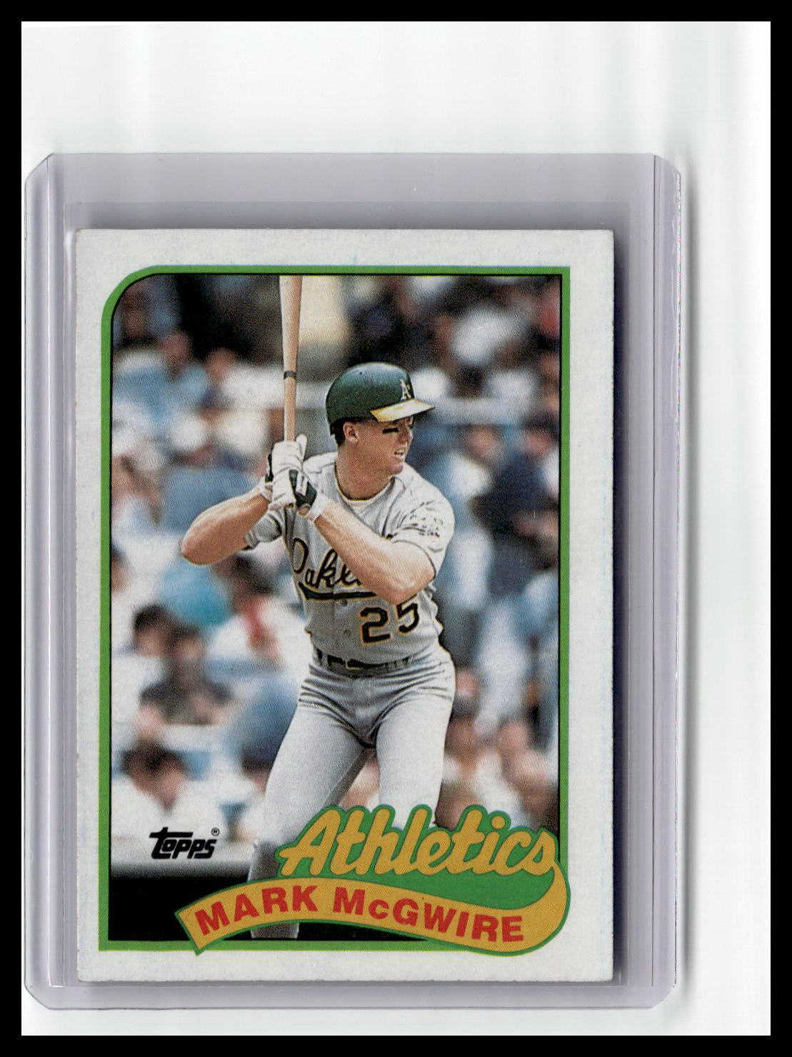 Baseball trading card of Mark McGwire with 'Athletics' logo and Topps branding.