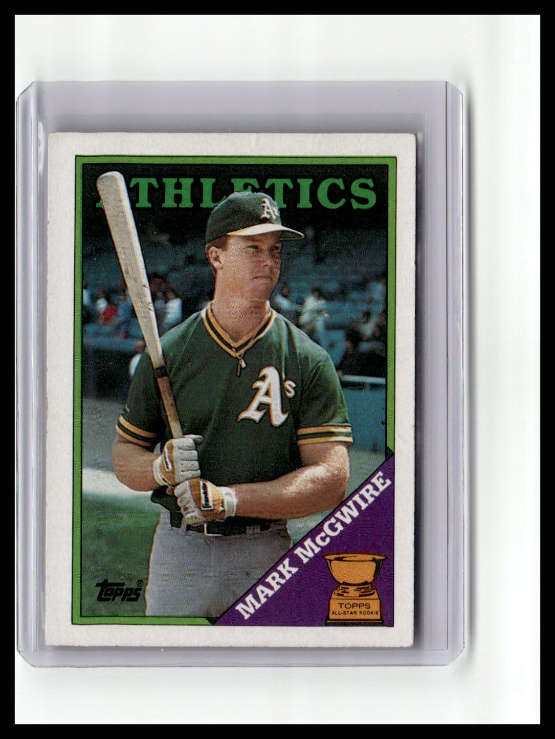 Baseball trading card of a player in a green uniform with a bat, encased in a protective holder.