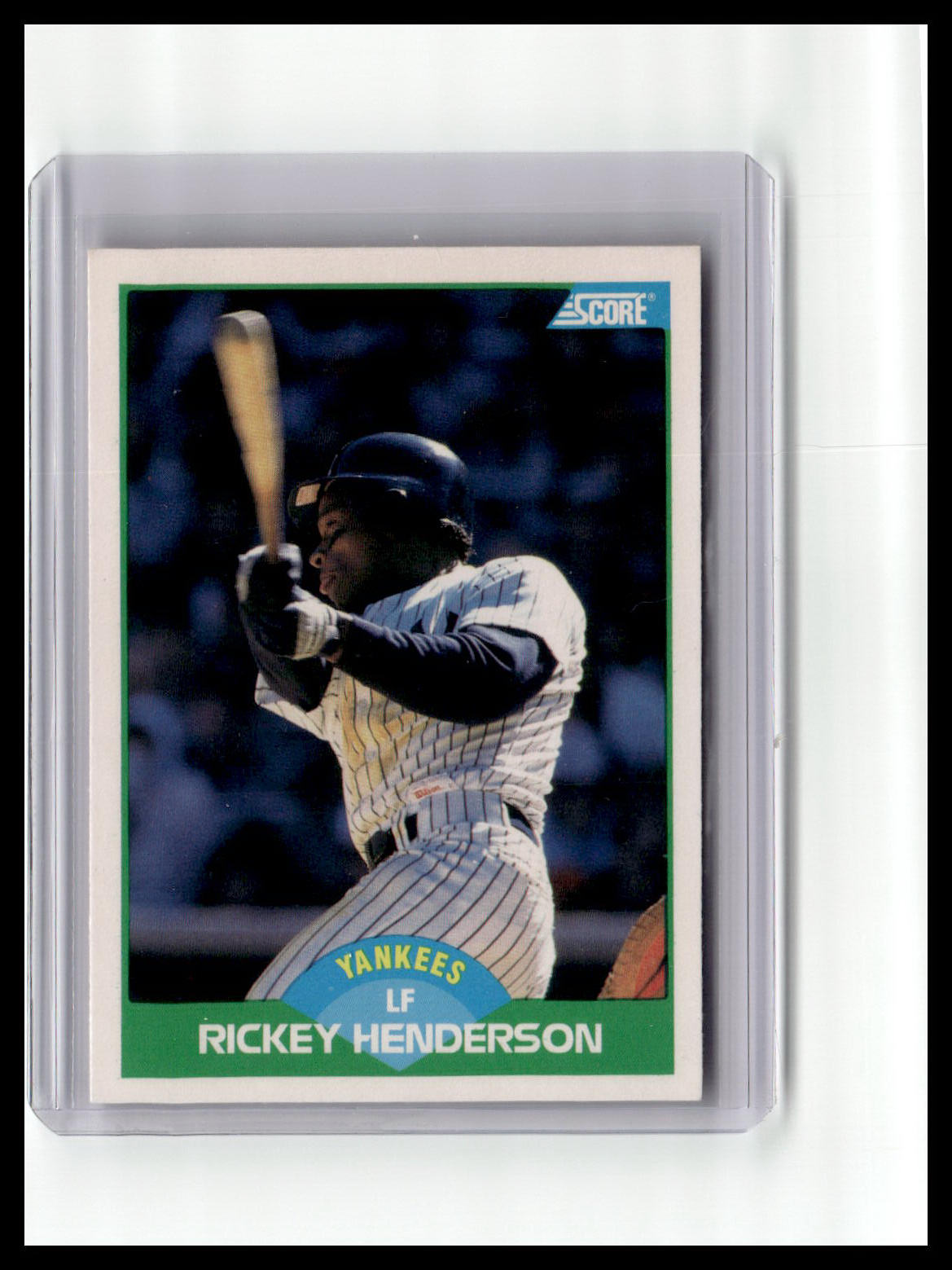 Baseball trading card of Rickey Henderson with a bat, framed by a white border.