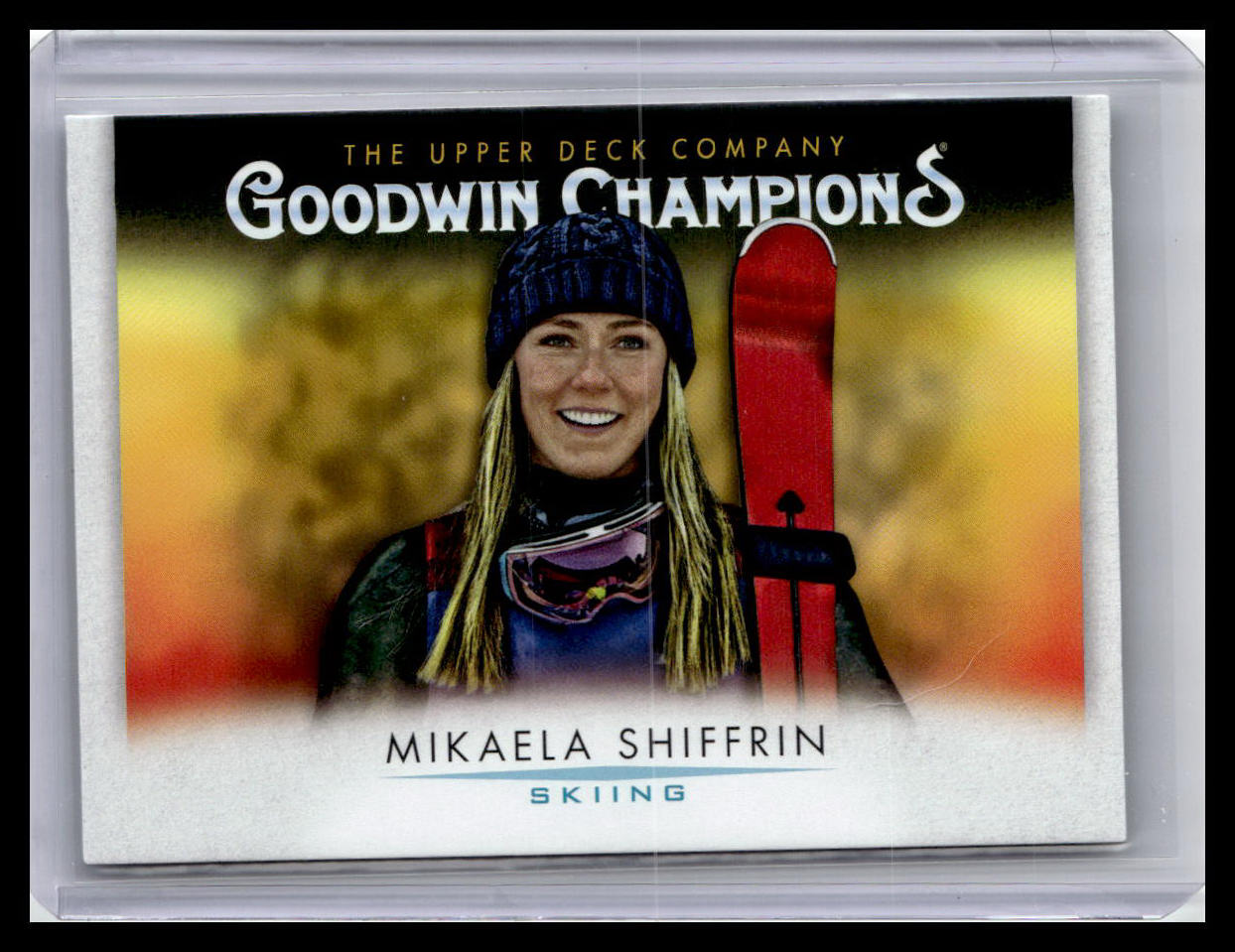 Trading card featuring Mikaela Shiffrin with a red ski and blurred background