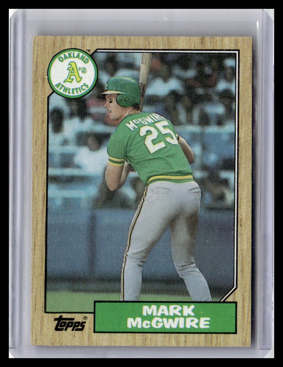 Baseball trading card of Mark McGwire in a green Oakland Athletics uniform