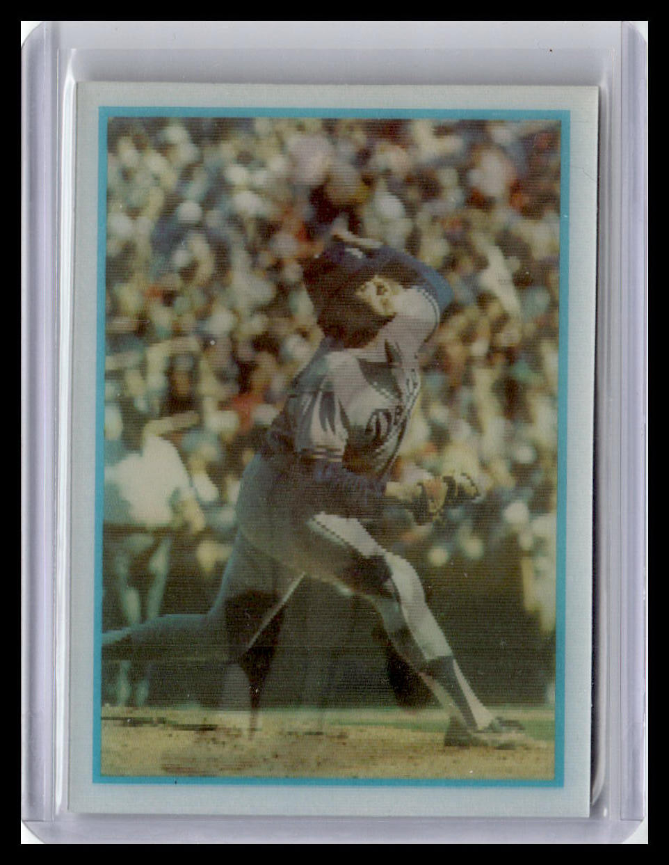 Baseball trading card of a player in action with a crowd in the background