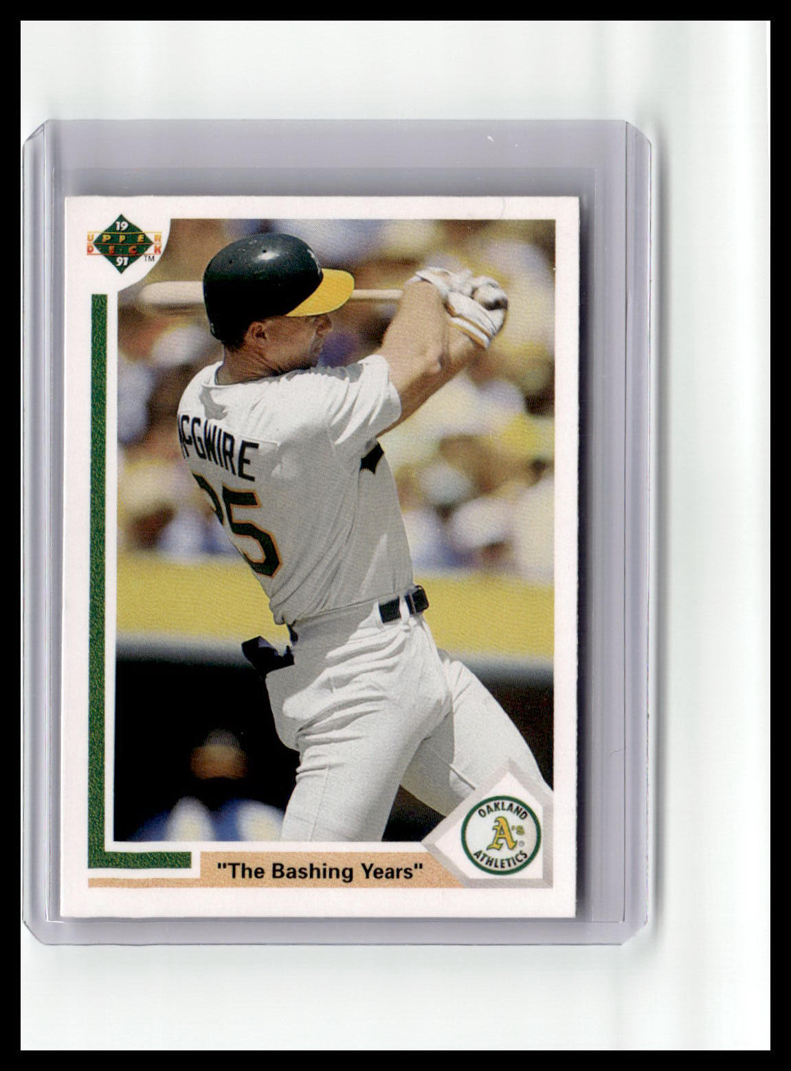 Baseball trading card of a player in a white uniform with a green border