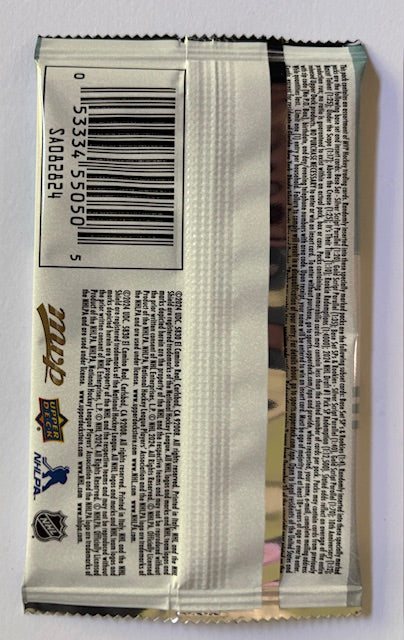 Close-up of a product packaging with text and a barcode on a white background
