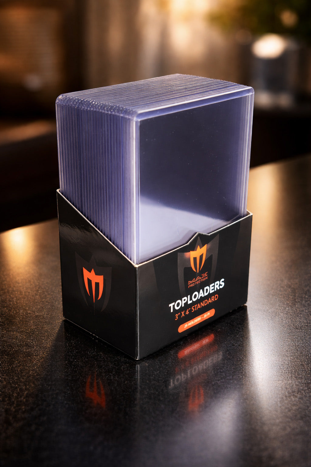 Card holder with toploaders on a dark surface